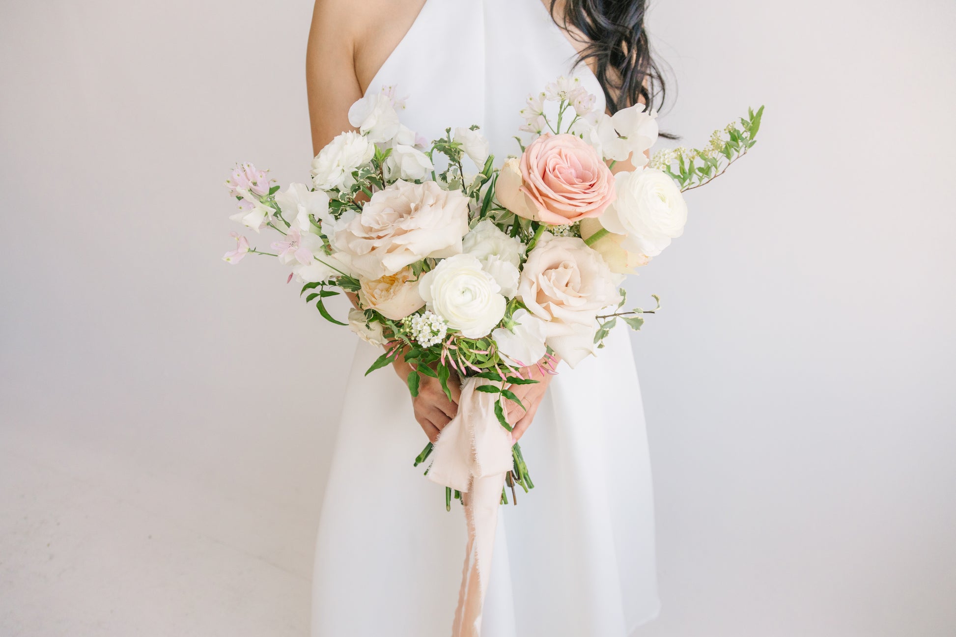 Premium neutral wedding bouquet with lush seasonal flowers