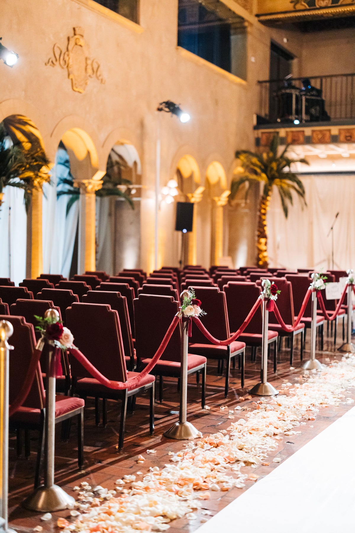 Blush and White Rose Petals along the sides of a wedding aisle